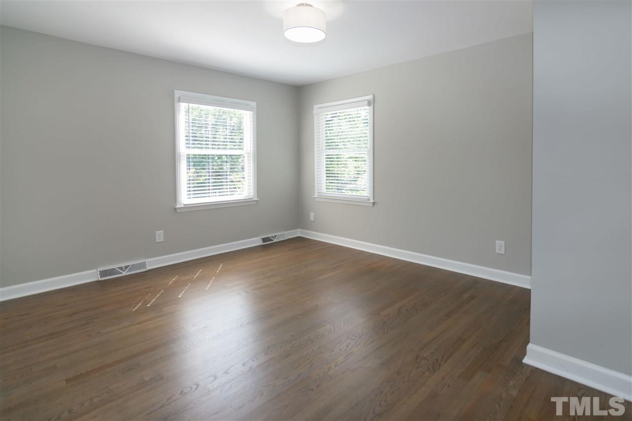 3804 Colgate Place Raleigh, NC 27609 - Photo 23 of 30 an empty room with wooden floor and windows