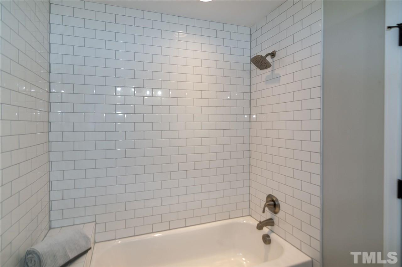 3804 Colgate Place Raleigh, NC 27609 - Photo 25 of 30 a bathroom with a bathtub