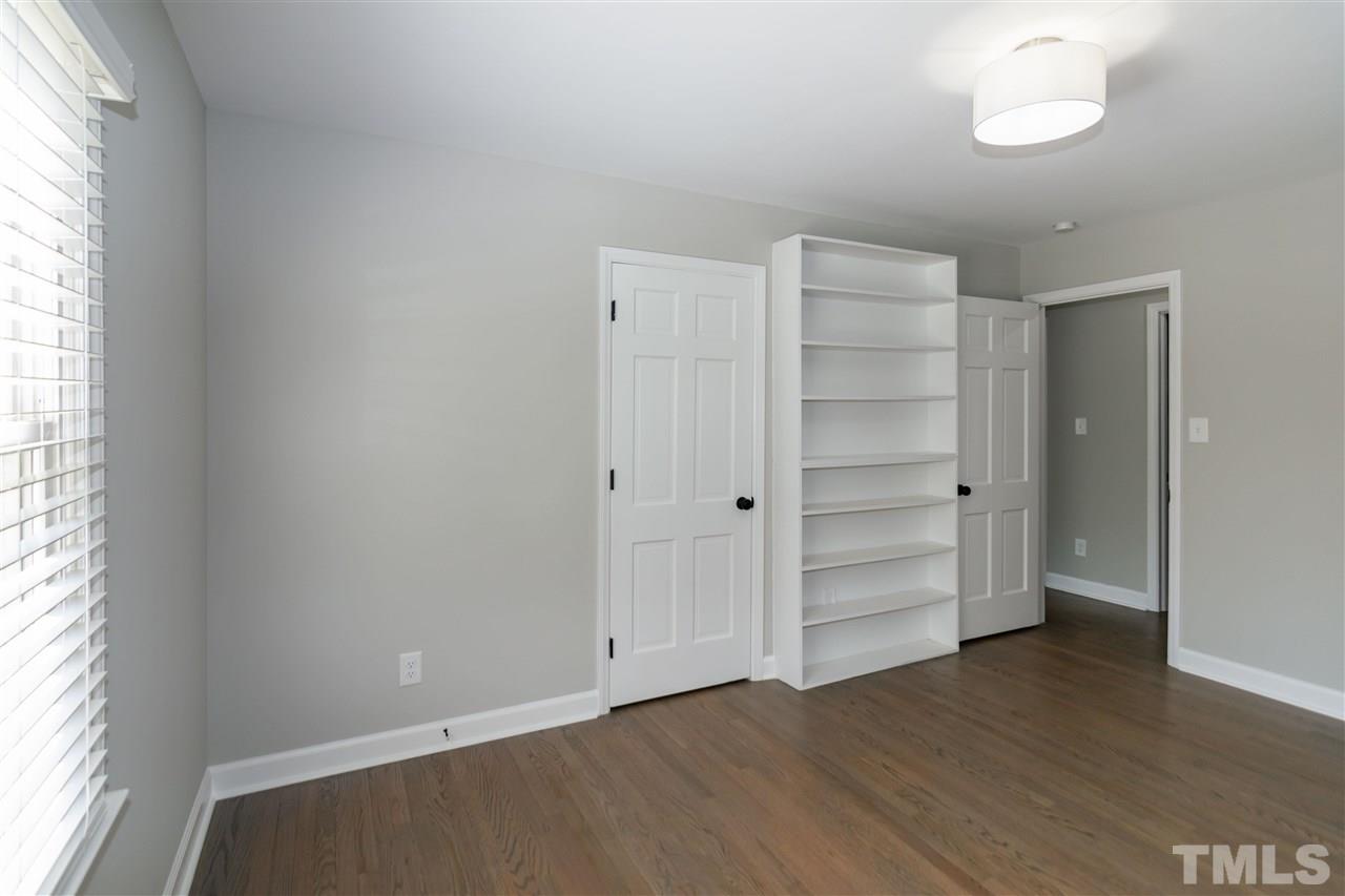 3804 Colgate Place Raleigh, NC 27609 - Photo 26 of 30 an empty room with cabinet and wooden floor