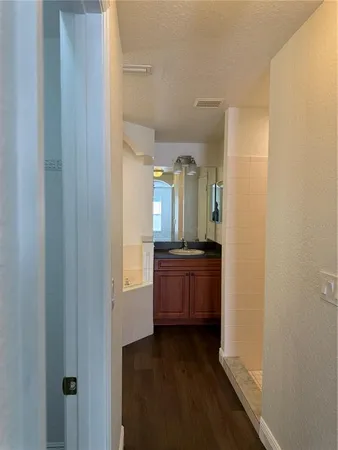 a bathroom with a double vanity sink and a mirror