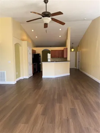 a view of a room with wooden floor