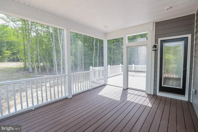 a view of a room with wooden floor and balcony
