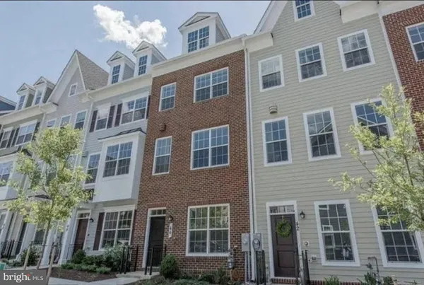 a front view of a building with balcony