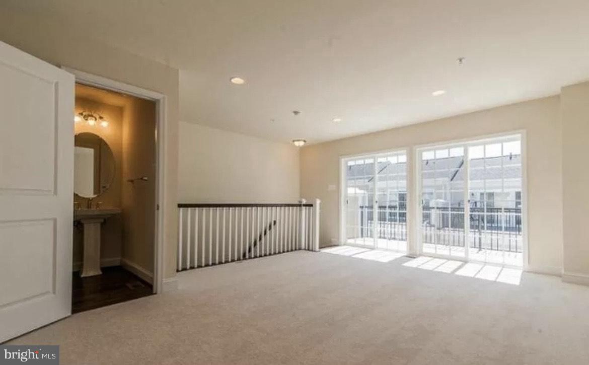 44 Linden Place Towson, MD 21286 - Photo 12 of 16 a view of an empty room with a window