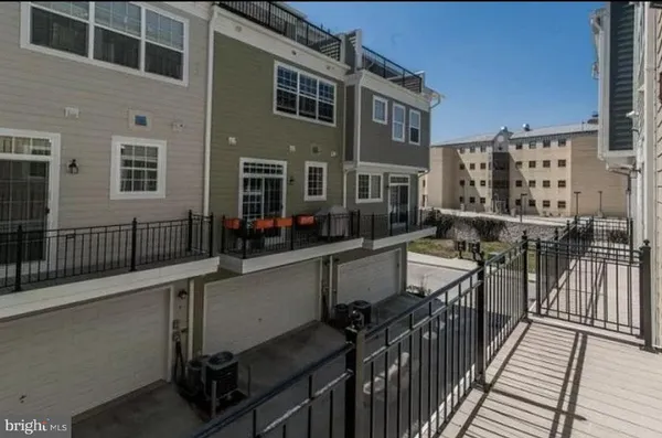 a balcony view with wooden floor and outdoor seating