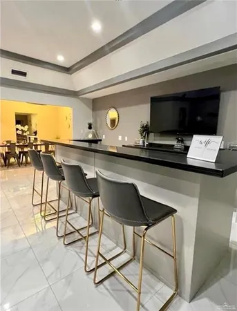 a kitchen with a table and chairs in it