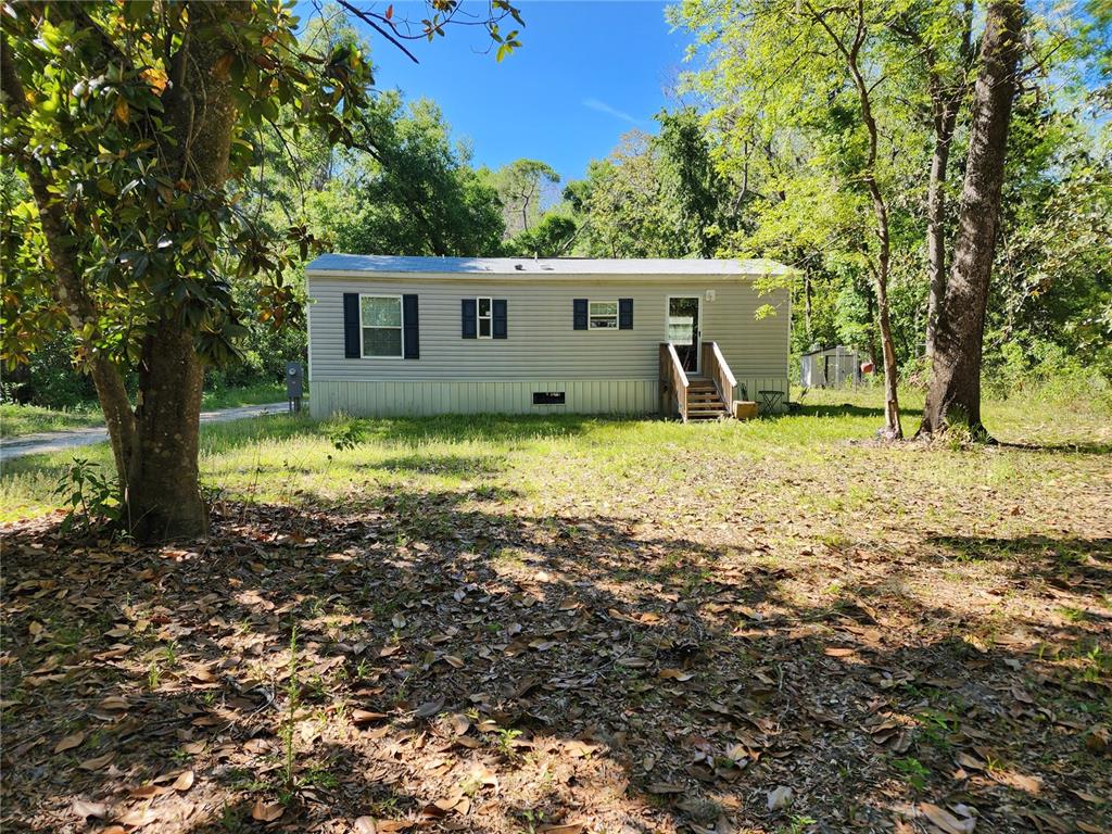 4150 South Spaniel Trail Inverness, FL 34450 - Photo 1 of 25 a view of a house with a yard