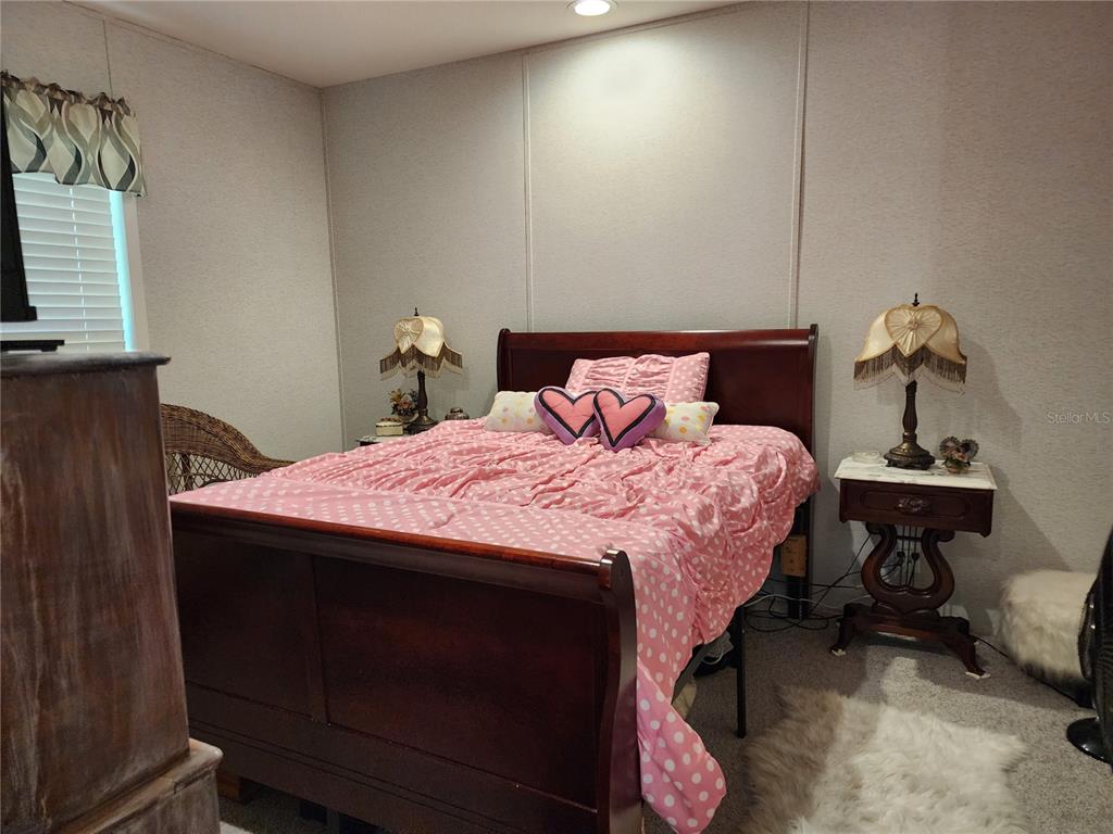 4150 South Spaniel Trail Inverness, FL 34450 - Photo 11 of 25 a bedroom with a bed and a tv on table