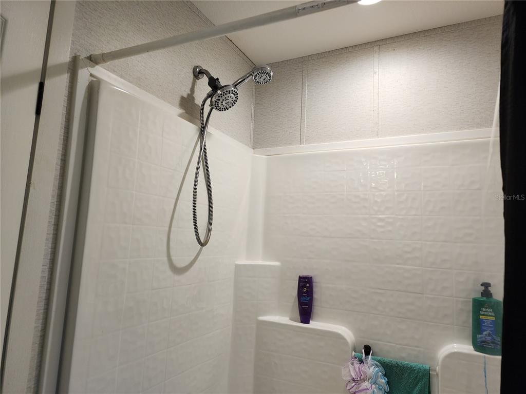 4150 South Spaniel Trail Inverness, FL 34450 - Photo 14 of 25 a bathroom with a shower and a toilet