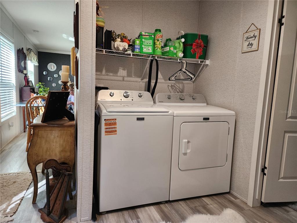 4150 South Spaniel Trail Inverness, FL 34450 - Photo 16 of 25 a view of storage and utility room with washer and dryer