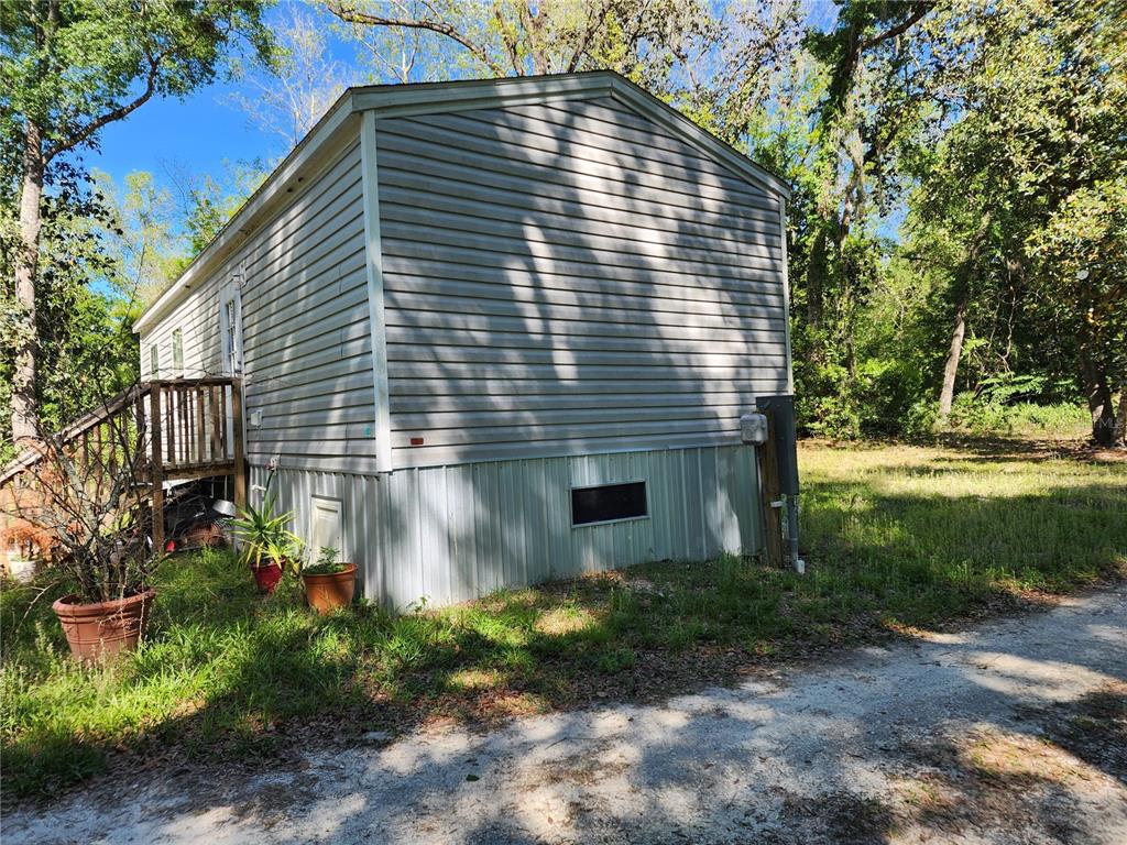 4150 South Spaniel Trail Inverness, FL 34450 - Photo 20 of 25 a front view of a house with garden