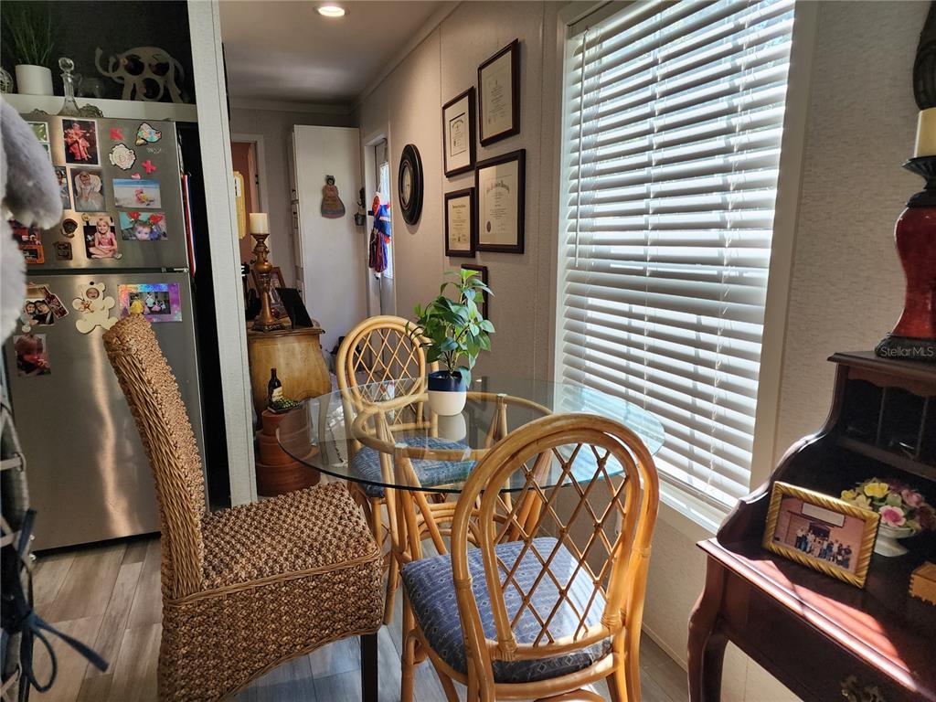 4150 South Spaniel Trail Inverness, FL 34450 - Photo 5 of 25 a view of a chairs and table in a room