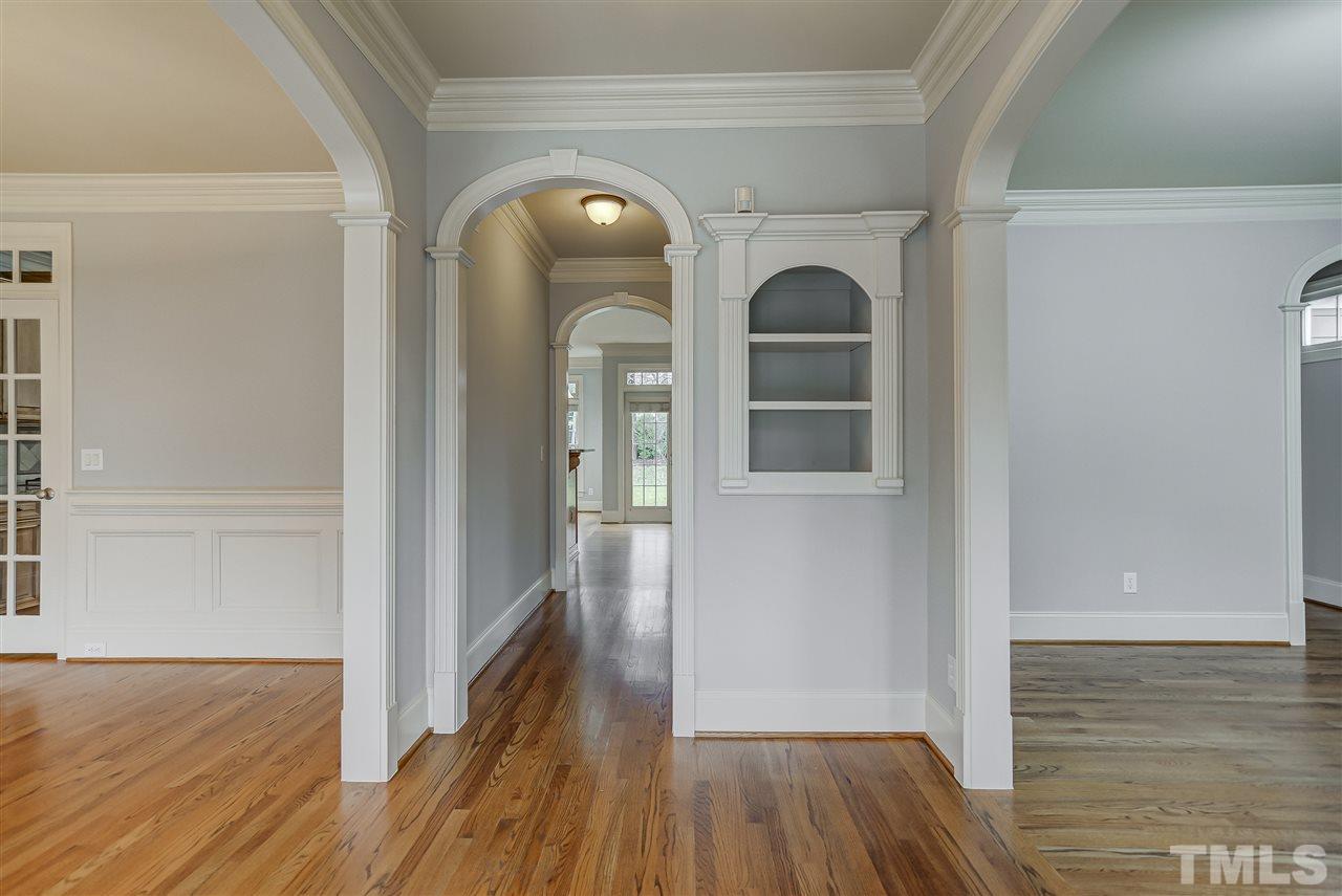 4213 Batiste Road Raleigh, NC 27613 - Photo 2 of 30 a view of a hallway with wooden floor