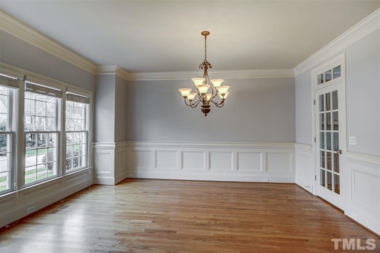 4213 Batiste Road Raleigh, NC 27613 - Photo 3 of 30 a view of an empty room with a window and wooden floor