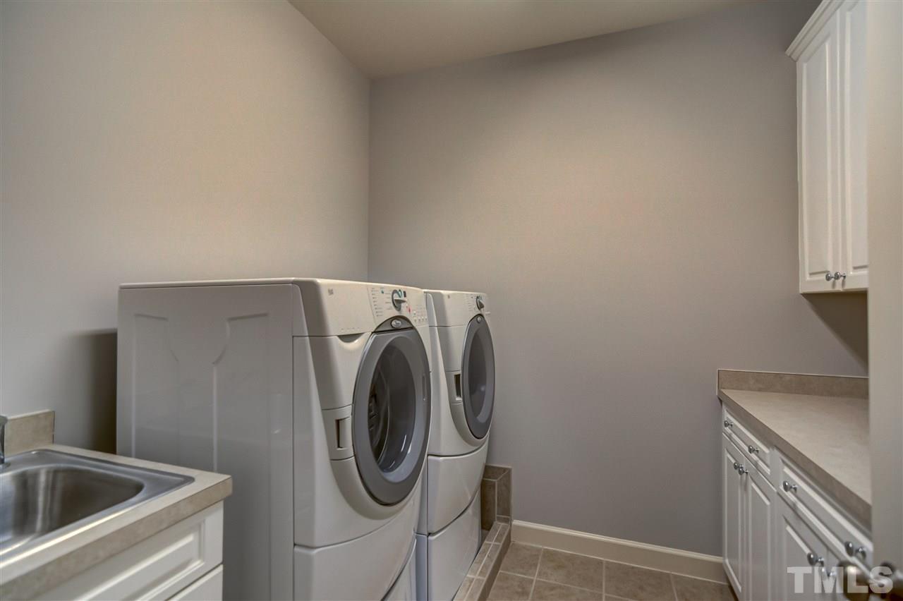 4213 Batiste Road Raleigh, NC 27613 - Photo 24 of 30 a utility room with dryer and washer