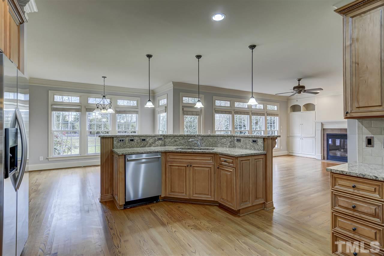4213 Batiste Road Raleigh, NC 27613 - Photo 9 of 30 a kitchen with stainless steel appliances granite countertop wooden floors and sink