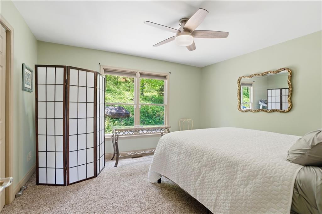 3326 Monument Road Jasper, GA 30143 - Photo 24 of 49 a bedroom with a large bed and a window