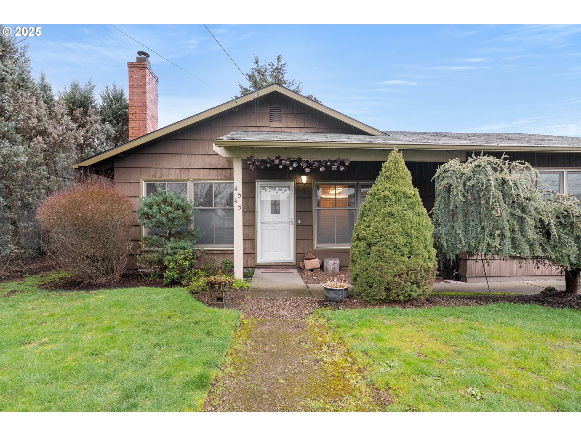 4545 Northeast 76th Avenue Portland, OR 97218 - Photo 1 of 37 a front view of a house with garden