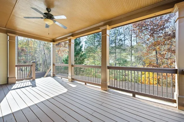 a view of a balcony with wooden floor