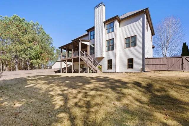 a view of a house with a snow on the road