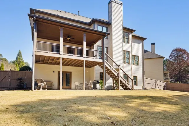 a front view of a building with a yard