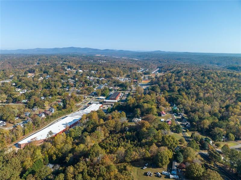 286 Lowry Street Ball Ground, GA 30107 - Photo 20 of 25 an aerial view of residential houses with outdoor space