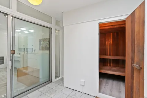 a bathroom with a shower and a sink