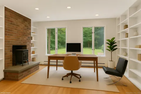 a living room with furniture a window and a fireplace