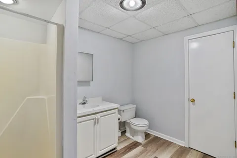 a white toilet sitting next to a bathroom sink
