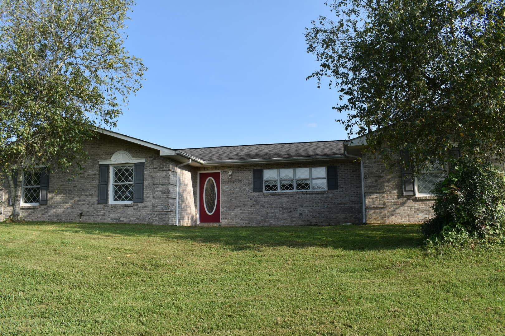 1513 Leatherwood Road Oneida, TN 37841 - Photo 1 of 37 a front view of house with yard