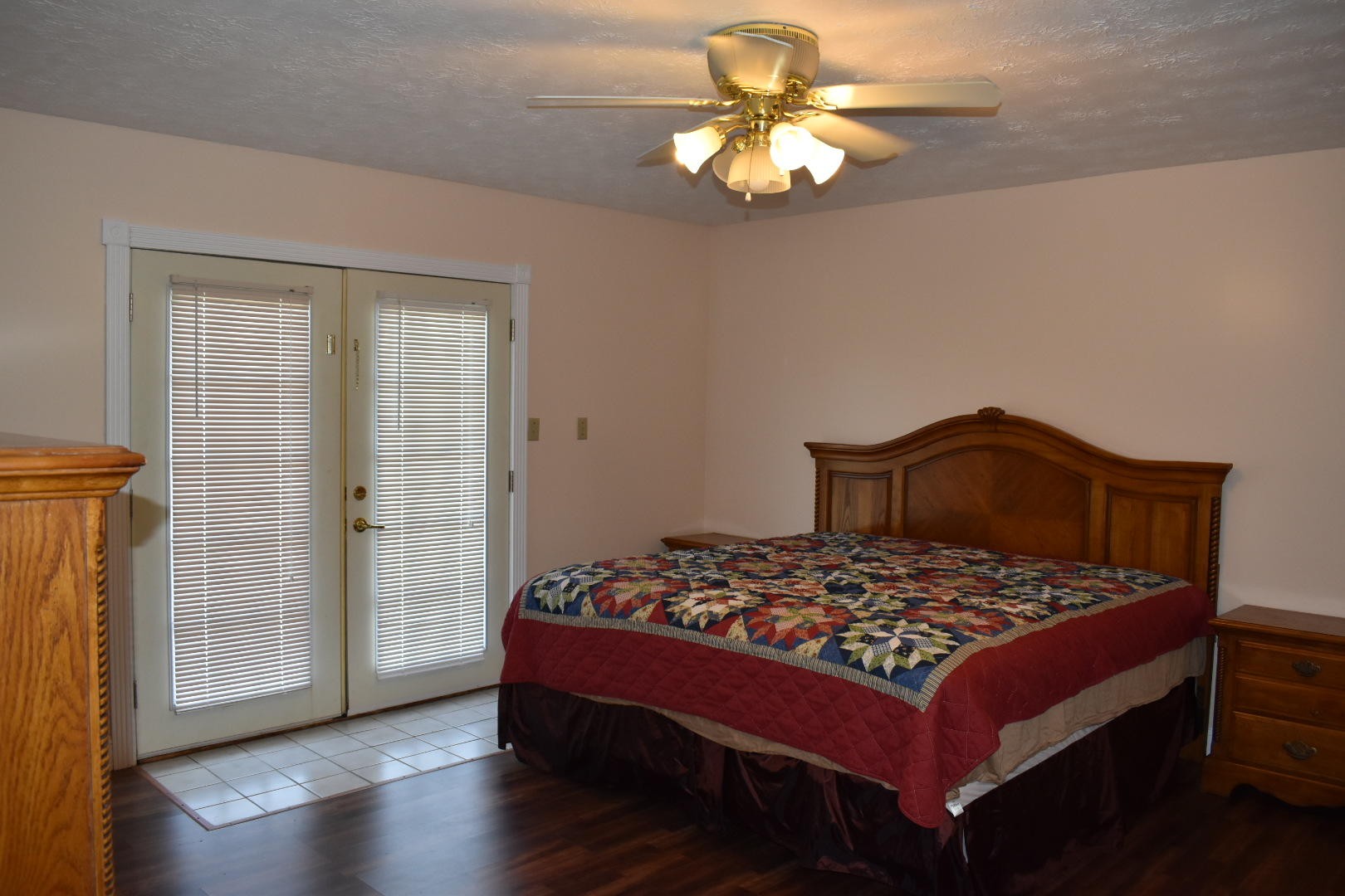 1513 Leatherwood Road Oneida, TN 37841 - Photo 14 of 37 a bedroom with a bed and a chandelier