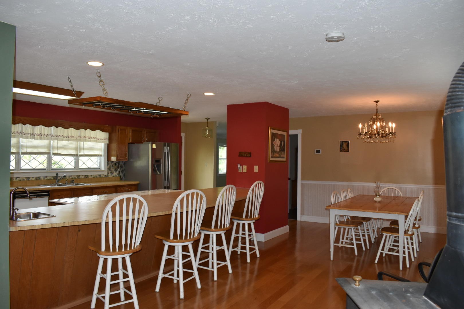 1513 Leatherwood Road Oneida, TN 37841 - Photo 19 of 37 a view of a dining room with furniture window and wooden floor