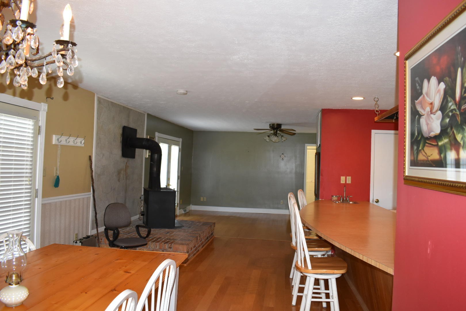 1513 Leatherwood Road Oneida, TN 37841 - Photo 20 of 37 a bedroom with a bed and a chandelier