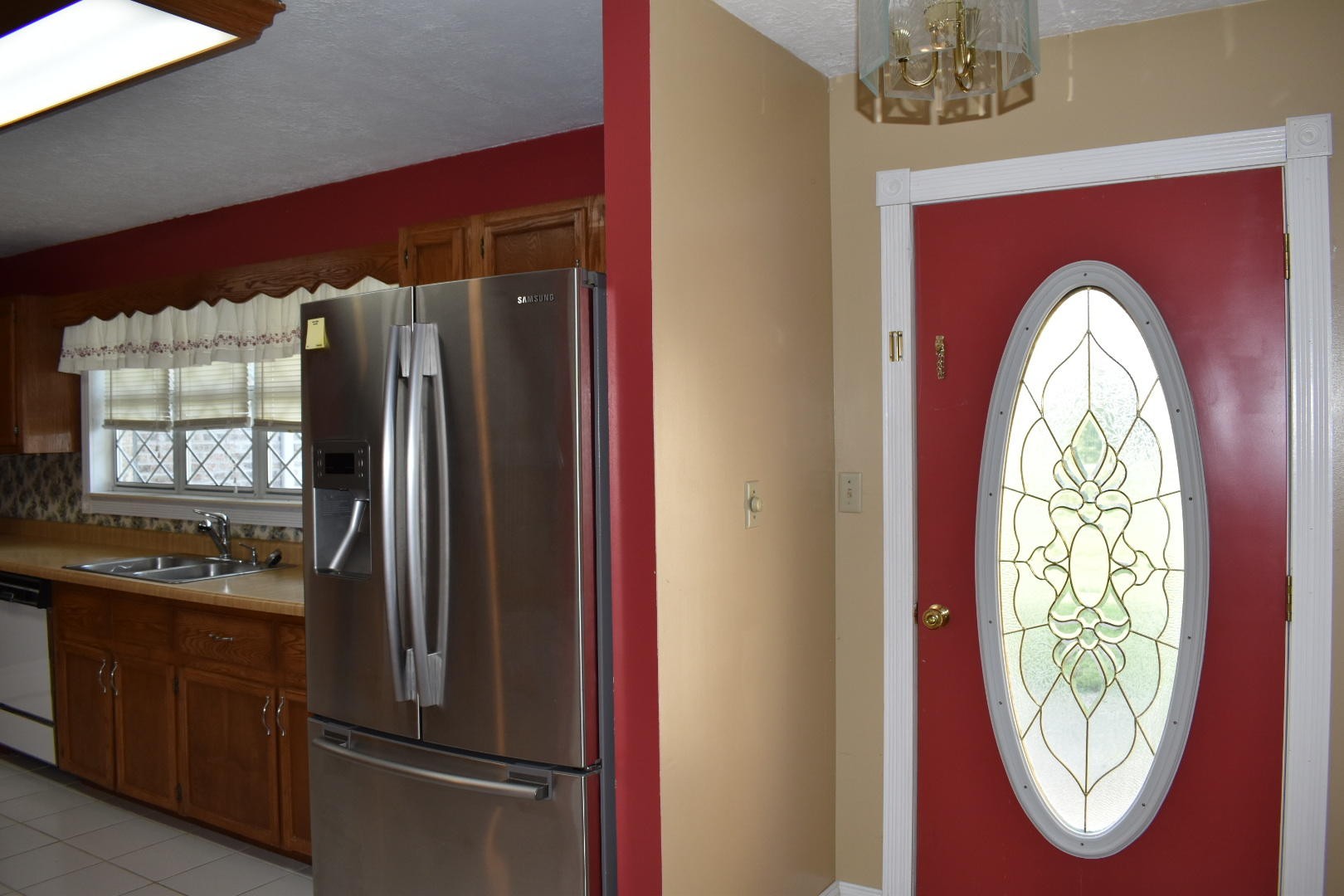 1513 Leatherwood Road Oneida, TN 37841 - Photo 23 of 37 a kitchen with stainless steel appliances granite countertop a refrigerator a stove and a wooden floors