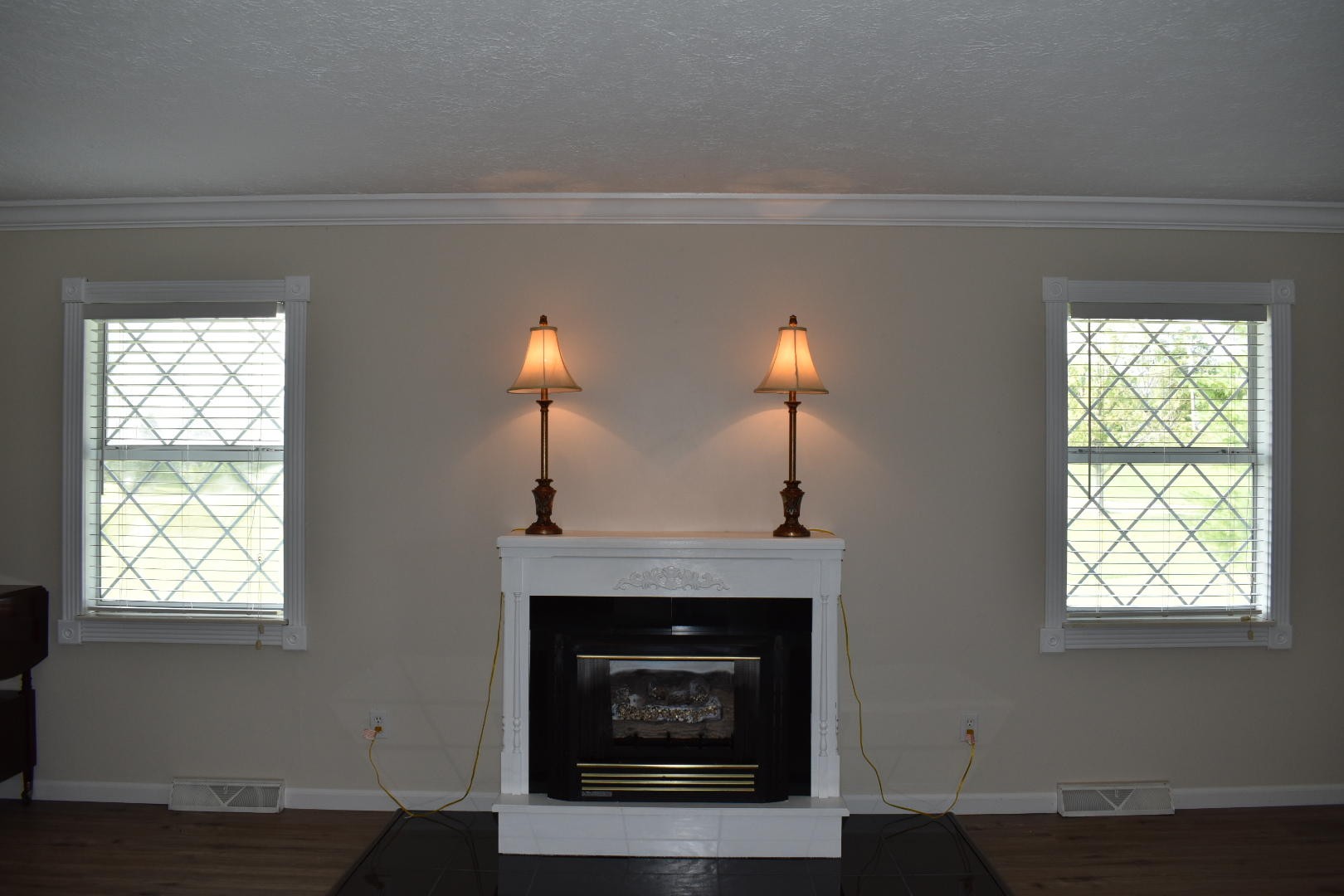 1513 Leatherwood Road Oneida, TN 37841 - Photo 26 of 37 a living room with a fireplace and windows