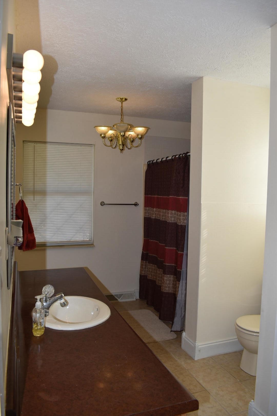 1513 Leatherwood Road Oneida, TN 37841 - Photo 27 of 37 a bathroom with a sink a toilet and mirror