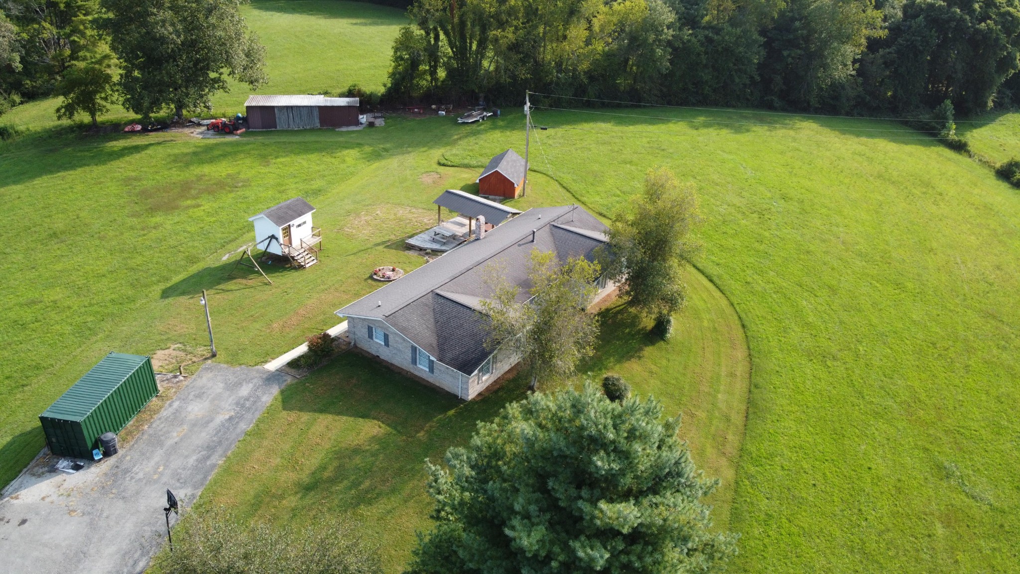 1513 Leatherwood Road Oneida, TN 37841 - Photo 34 of 37 an aerial view of a house with swimming pool and garden