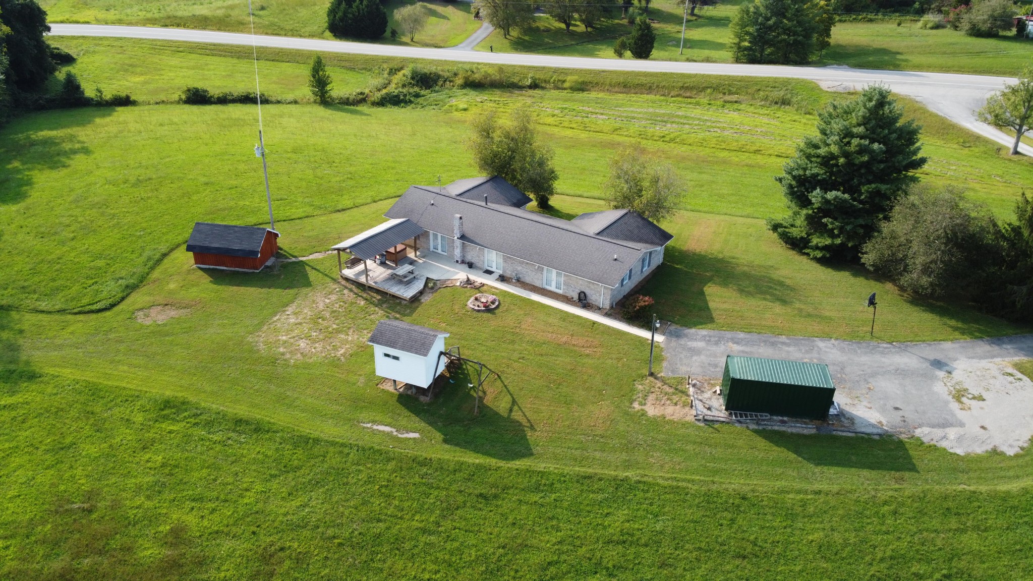 1513 Leatherwood Road Oneida, TN 37841 - Photo 35 of 37 a aerial view of a house with a garden and lake view