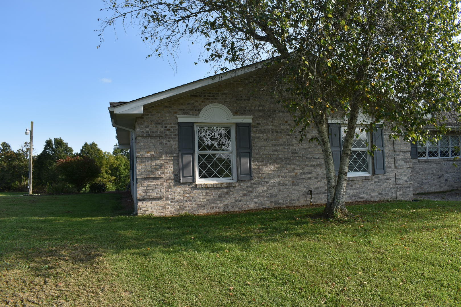1513 Leatherwood Road Oneida, TN 37841 - Photo 5 of 37 a front view of a house with garden