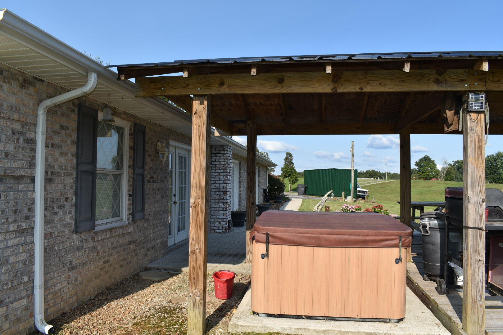 1513 Leatherwood Road Oneida, TN 37841 - Photo 8 of 37 a view of a patio with table and chairs under an umbrella