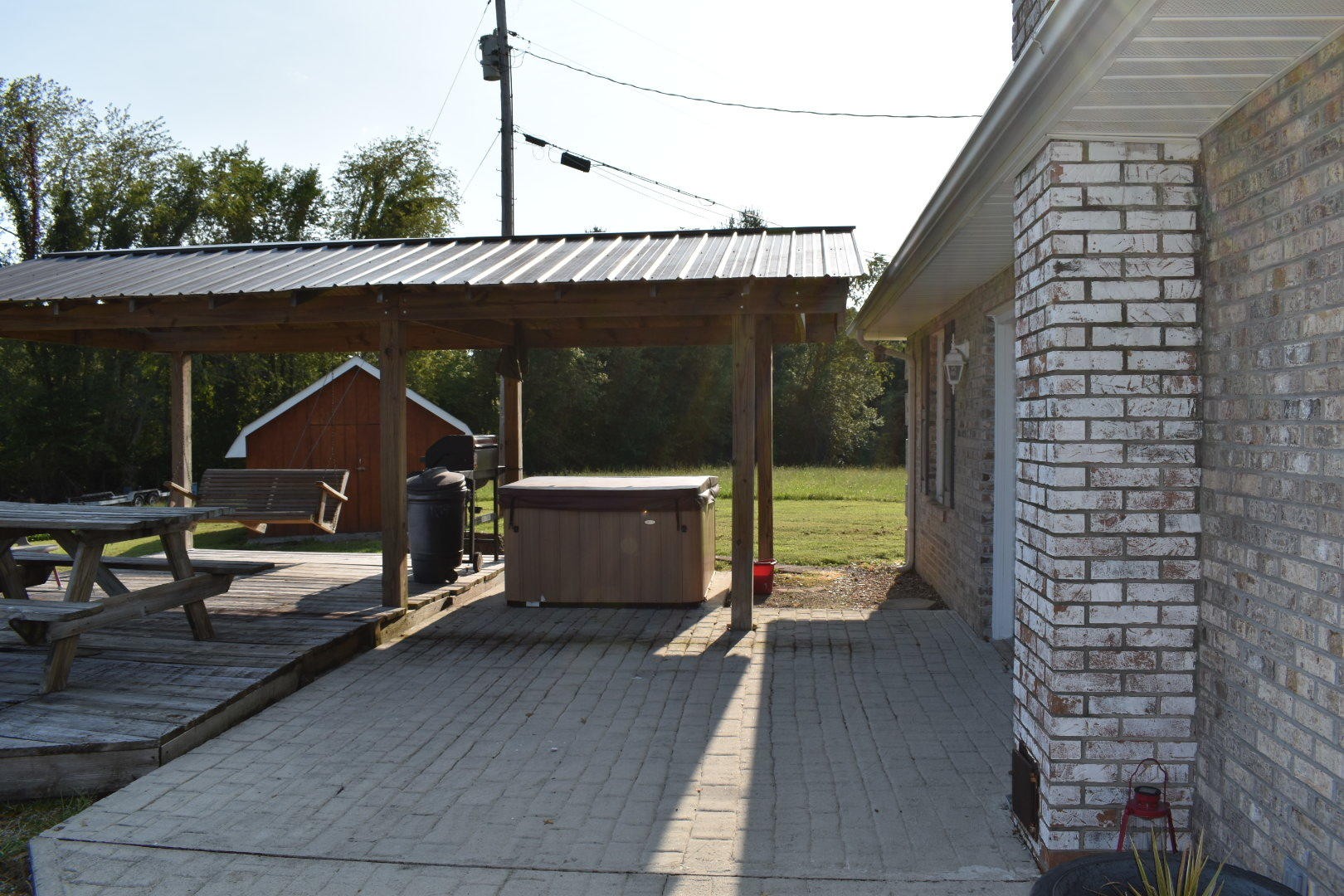 1513 Leatherwood Road Oneida, TN 37841 - Photo 9 of 37 a view of a patio with table and chairs with wooden floor and fence