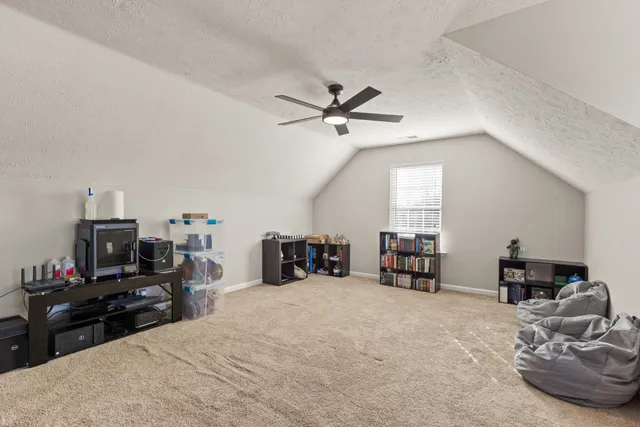 a bed room with furniture and a flat screen tv