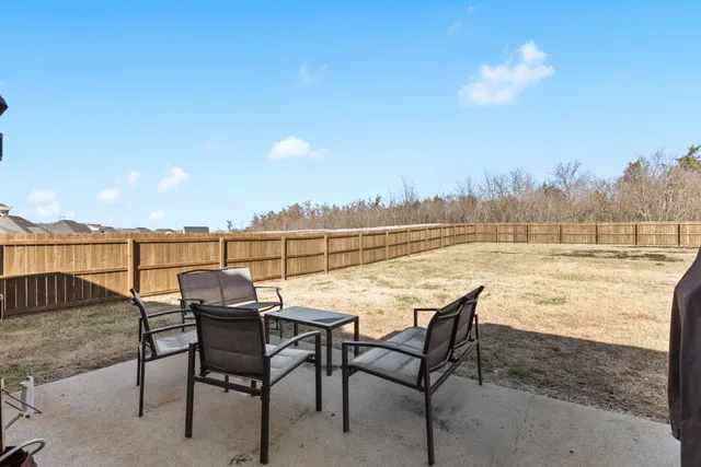 a view of a terrace with furniture and stove