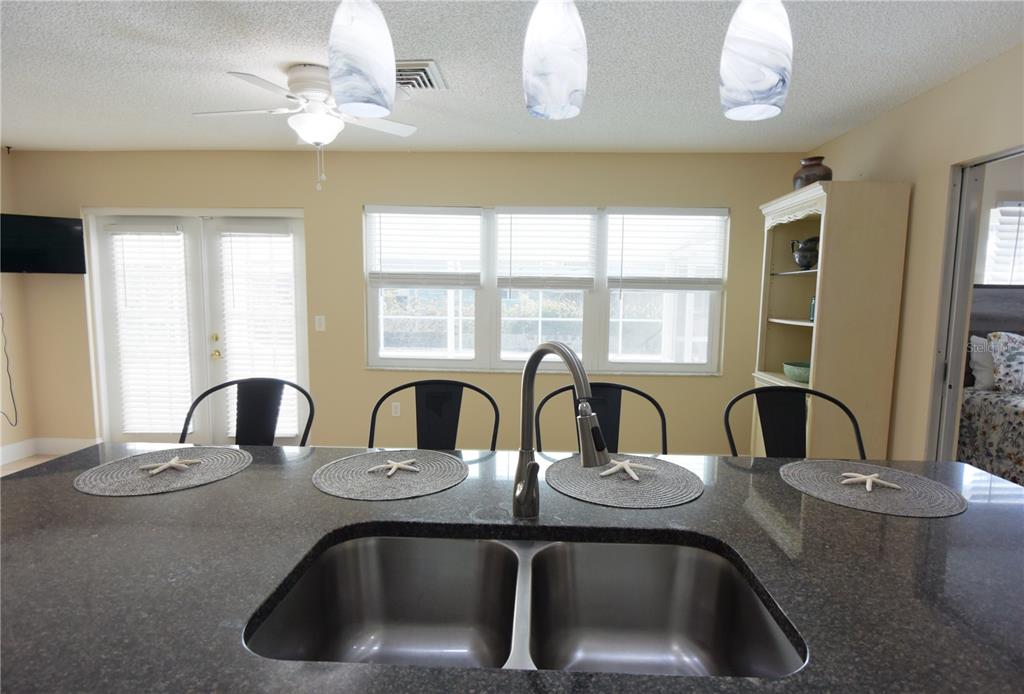 170 Argus Road Venice, FL 34293 - Photo 11 of 36 a bathroom with a double vanity sink and a mirror