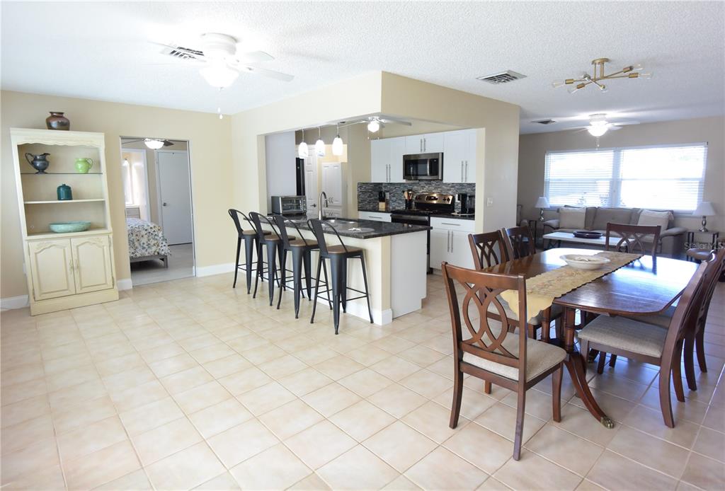 170 Argus Road Venice, FL 34293 - Photo 13 of 36 a view of a dining room with furniture