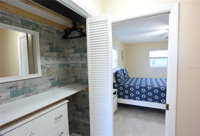 a bathroom with a sink a mirror and a shower