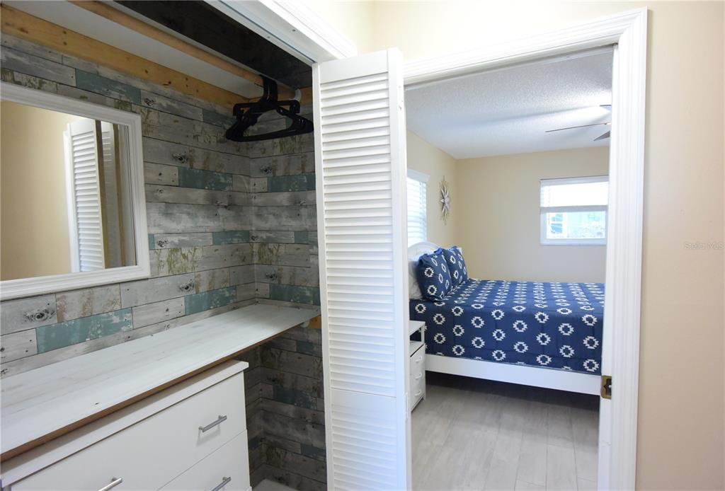 170 Argus Road Venice, FL 34293 - Photo 17 of 36 a bathroom with a sink a mirror and a shower