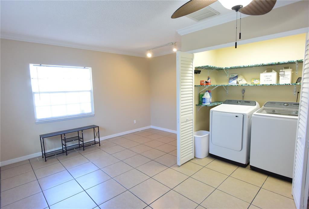 170 Argus Road Venice, FL 34293 - Photo 25 of 36 a view of a kitchen with storage and utility