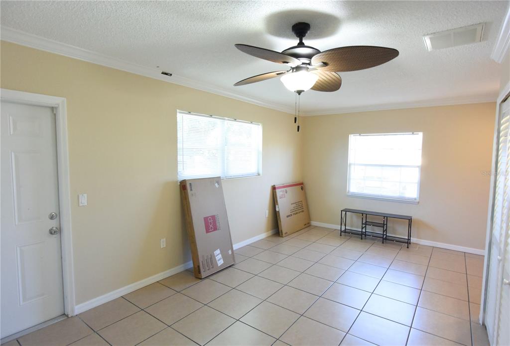 170 Argus Road Venice, FL 34293 - Photo 27 of 36 a view of dining room with furniture and windows
