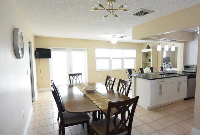 a view of a dining room with furniture and window